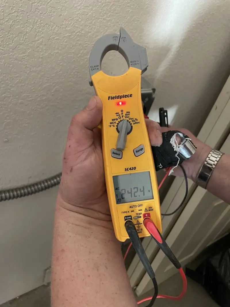Voltage testing with clamp meter during Recessed Lighting Installation in Chillicothe